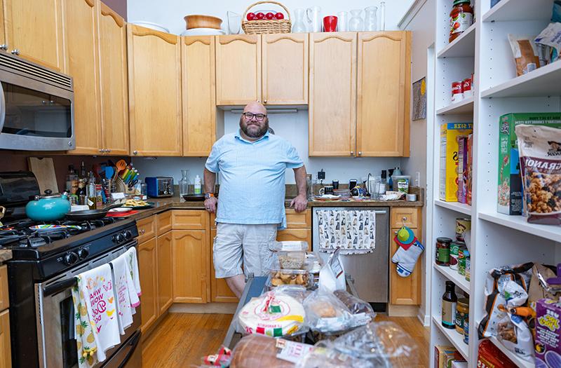 Jonathan Springborn standing in his kitchen.